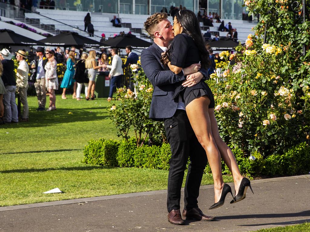 Two happy punters share a kiss after the race. Picture: Jenny Evans/Getty Images