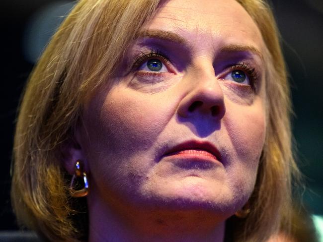 BIRMINGHAM, ENGLAND - OCTOBER 02: British Prime Minister Liz Truss watches a tribute to Queen Elizabeth II on day one of the annual Conservative Party conference on October 02, 2022 in Birmingham, England. This year the Conservative Party Conference will be looking at 
