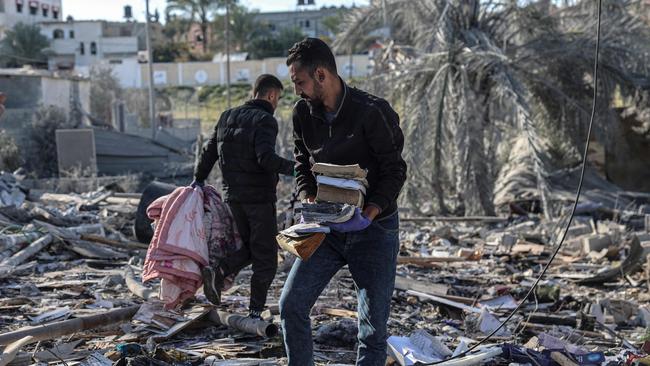 Palestinians search for their belongings amid the rubble in Rafah. Picture: AFP