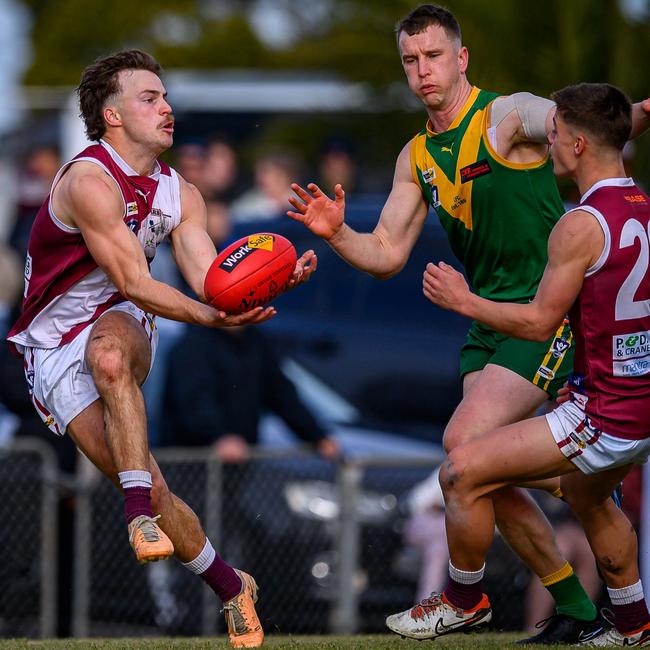 Traralgon's Harvey Neocleous marks in front of Leongatha's Cade Maskell in the grand final. Picture: Warren ‘Wazshots’ Leyden