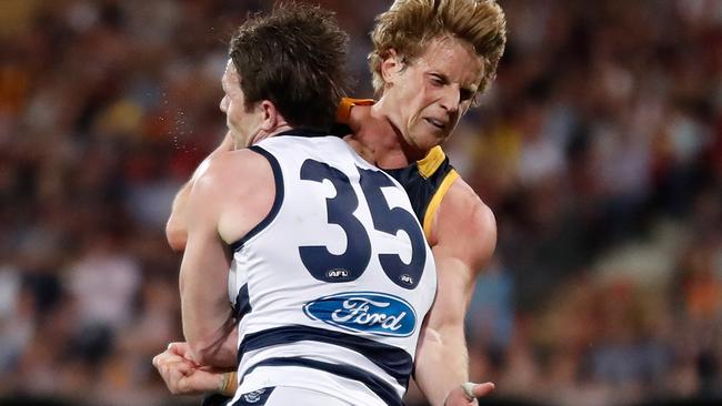 Rory Sloane and Patrick Dangerfield collide in a brutal collision on Friday night. Picture: Getty