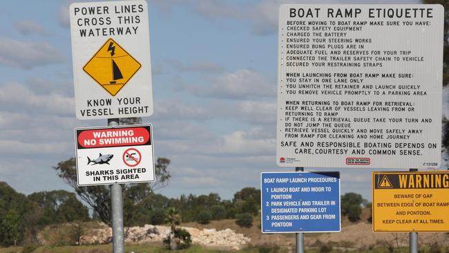 Shark warning signs were installed along the Chipping Norton Lake to warn users. Picture: Tim Clapin