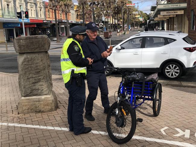 This e-trike rider was asking police for more information about the conditions he needed to comply with. Picture: Jim O'Rourke