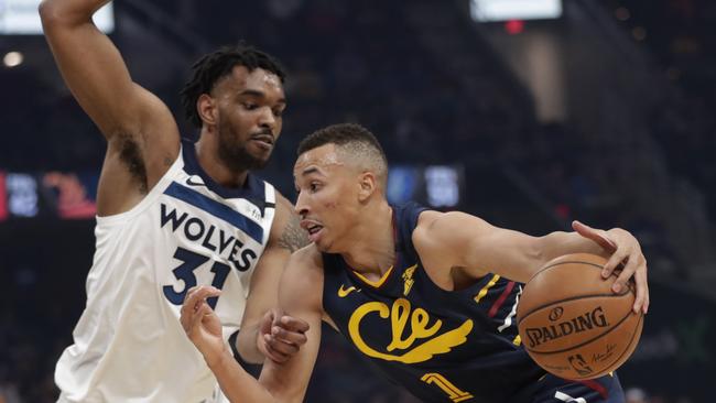 Cleveland Cavaliers' Dante Exum (1) drives past Minnesota Timberwolves' Keita Bates-Diop (31) in the first half of an NBA basketball game, Sunday, Jan. 5, 2020, in Cleveland. (AP Photo/Tony Dejak)