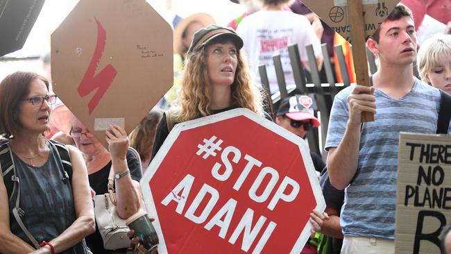 Anti-Adani coal mine protesters engage in a sit-in protest outside the Queensland government headquarters in Brisbane, after Adani announced it had the funds it needed to move forward with Carmichael mine. Picture: AAP 