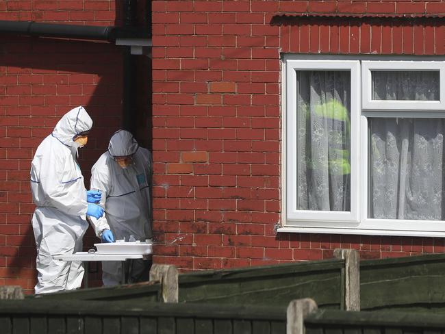 Police forensic investigators search the property of Salman Abedi. Picture: Danny Lawson/PA via AP