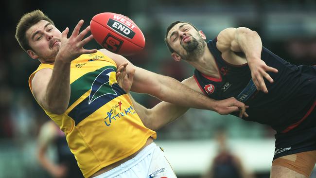 Eagles top goalkicker Michael Wundke takes on Norwood's Alexis Greorgiou. Picture: Tom Huntley