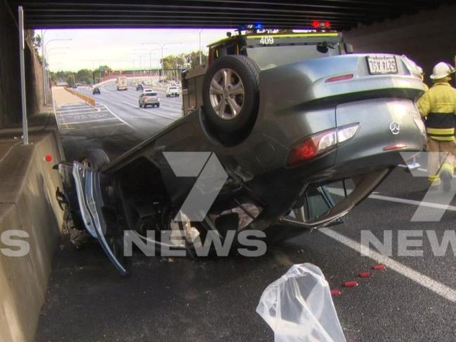 A car flipped on its roof during a massive Expressway pile-up. Picture: 7NEWS Adelaide