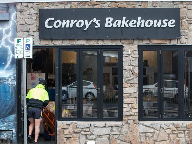 A delivery man enters Conroy’s Bakehouse, which is open for business, this morning. Picture: Sarah Matray