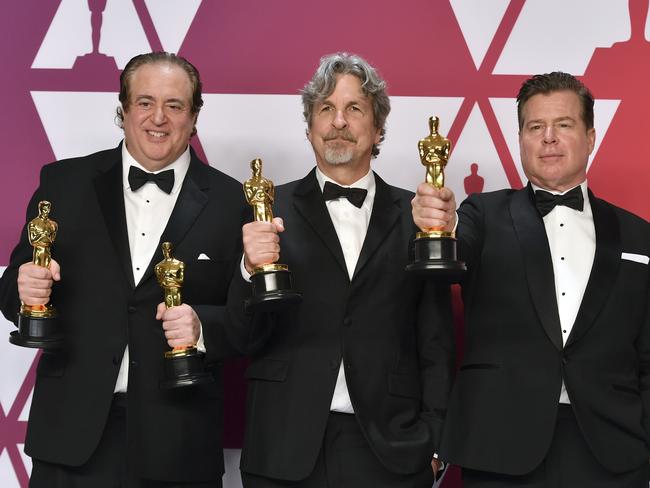 Nick Vallelonga, from left, Peter Farrelly, and Brian Currie pose with the award for best picture for "Green Book". Picture: AP