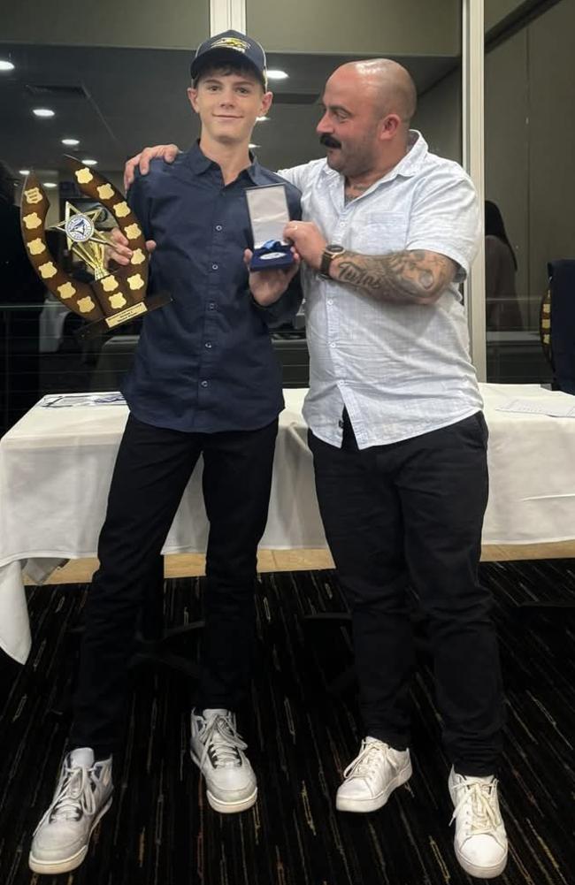 Bailey Peel, 11, receiving the Bluelow award from Club Gold Sponsor Adelaide Transport Hydraulics representative, Steven Finlay-Smith. Picture: Supplied