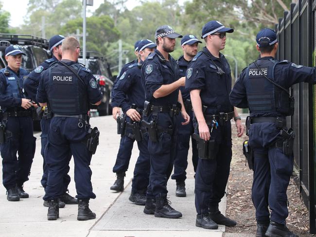 Police searching for two men who fled on foot following two alleged home invasions. They found one man at Prestons Public School. Picture: David Swift