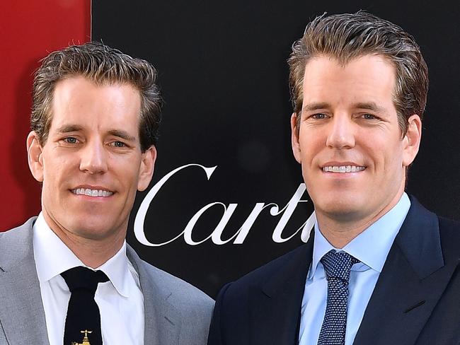 (FILES) In this file photo taken on June 5, 2018, US entrepreneurs Cameron and Tyler Winklevoss arrive for the world premiere of Ocean's 8 in New York.                              A bitcoin exchange headed by Cameron and Tyler Winklevoss announced on July 6, 2018, it hired a former New York Stock Exchange executive to head its technology team as it seeks to bring cryptocurrency to a wider market. Robert Cornish, former chief information office at NYSE, will begin his job as chief technology officer at New York-based Gemini later this month.  / AFP PHOTO / ANGELA WEISS