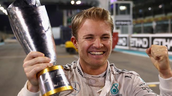 Nico Rosberg of Germany and Mercedes GP celebrates with his second place trophy after securing the F1 World Drivers Championship.