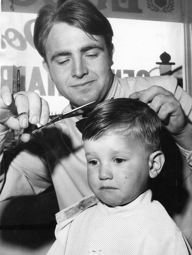 Barber D. Totinogives gives a woeful two-year-old Roberto Micucci his first haircut in 1970.