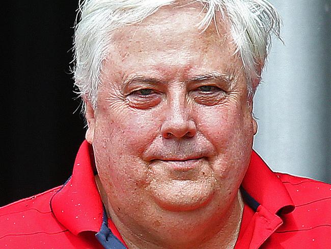 6/3/2016: Clive Palmer with businessman Domenic Martino walks past a Bollinger "Life can be Perfect" advert in the restaurant as he leaves after lunch with businessman Domenic Martino at Sanctuary Cove on the Gold Coast. Palmer seemed relaxed just a day before a creditors meeting over his nickel refinery in Townsville. Lyndon Mechielsen/The Australian