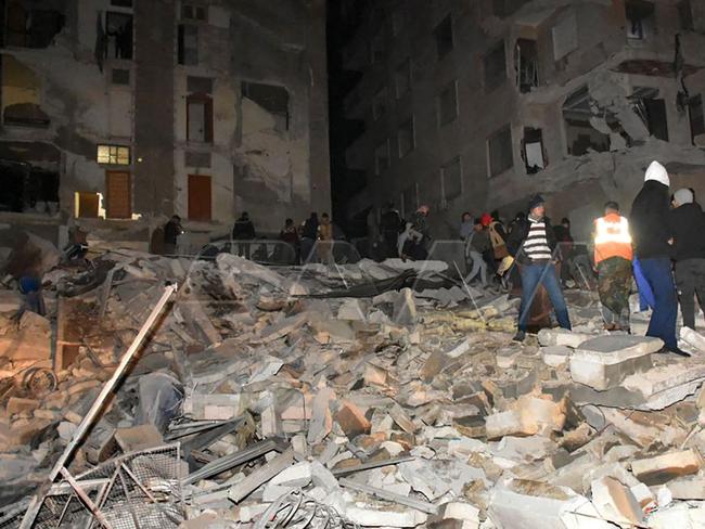 Rescuers search for survivors in Hama, Syria after the earthquake.