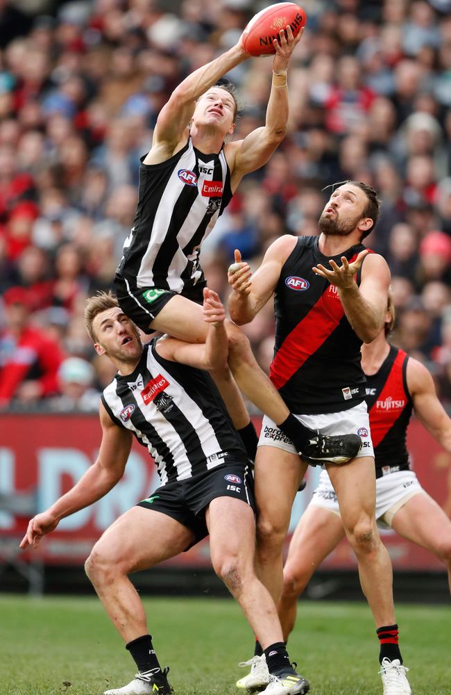 Tom Langdon takes a big grab against the Bombers.