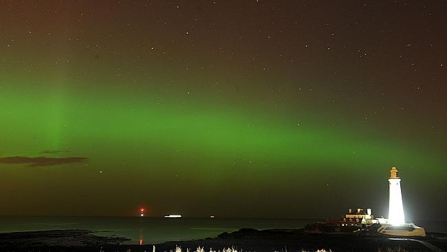 The aurora borealis over St. Mary's Lighthouse and Visitor Centre, Whitley Bay, North Tyneside, England. Picture: Owen Humphreys/PA Wire.