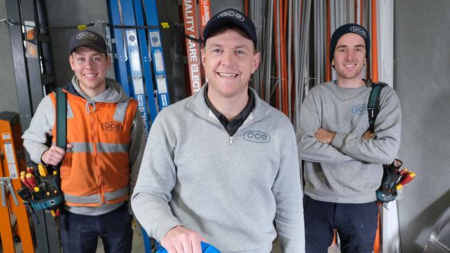 Boden Carkeek, centre, of Quality Care Electrical, has been voted Geelong's best sparky. He says it's a reflection of his whole team, including Angus Jenkinson, left, and Ben Grigsby. Picture: Mark Wilson.