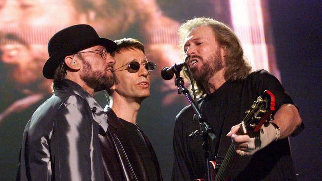 Maurice, Robin and Barry Gibb of the Bee Gees during concert at Stadium Australia