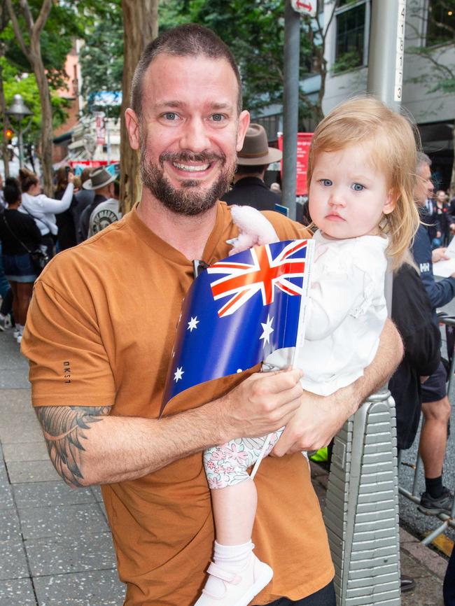 Thousands of people have braved the rain to gather in Brisbane for Anzac Day services. Picture: Grace Kessels