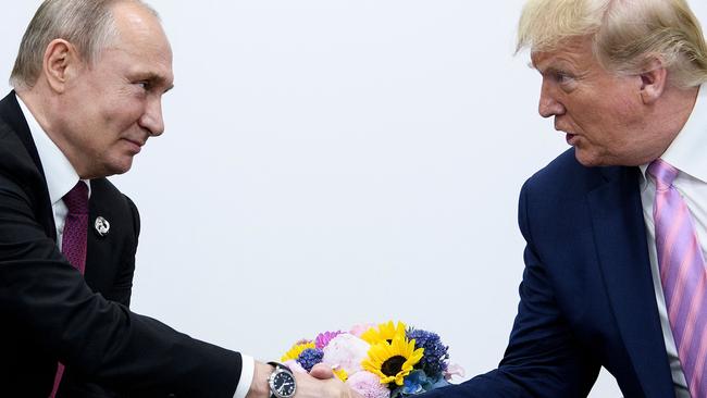 Former US president Donald Trump with Russia's President Vladimir Putin at the G20 summit in Japan. Mr Trump said he would urge Russian aggression against NATO allies. Picture: AFP