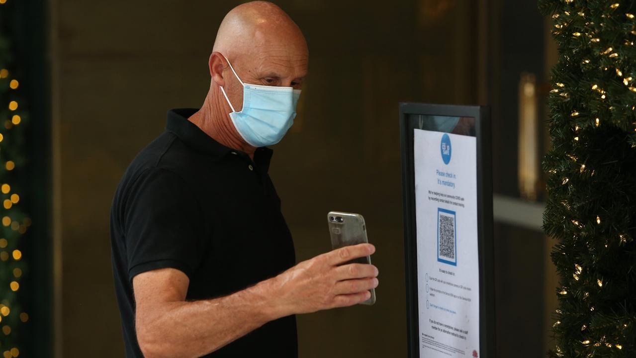 A shopper scans a QR code in Sydney’s CBD. Picture: Jason McCawley/Getty Images