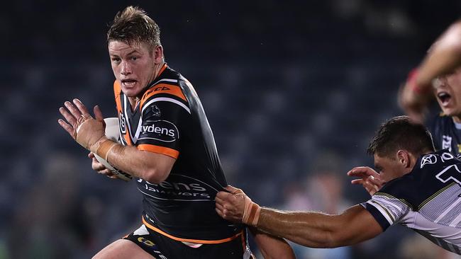 Harry Grant of the Tigers makes a break during the round-6 NRL match between the Wests Tigers and the North Queensland Cowboys. Picture: Mark Metcalfe/Getty Images