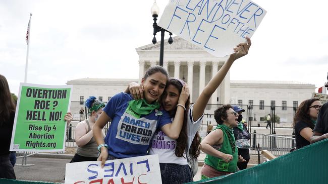 Anti- and pro-abortion activists gather outside the US Supreme Court after the overturning of Roe v Wade. Picture: AFP