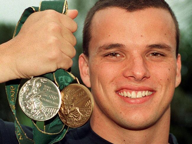 Miller with his medals that he won during the 1996 Atlanta Olympic Games.