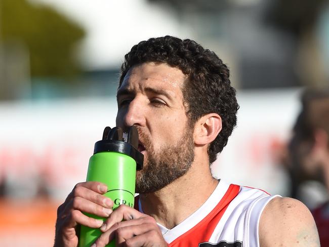 Nepean football league Grand Final: Sorrento v Frankston at Frankston Park. The Sharks went into the grand final as favourites and delivered another flag with a comfortable win over the Bombers. Sorrento coach Troy Schwarze grabs a drink at three quarter time. Picture: AAP/ Chris Eastman