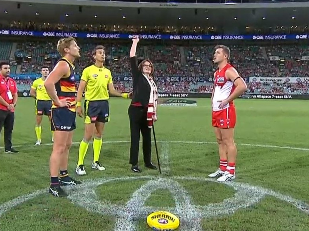 Plane crash survivor Cynthia Banham tossed the coin for the Swans and Crows match.