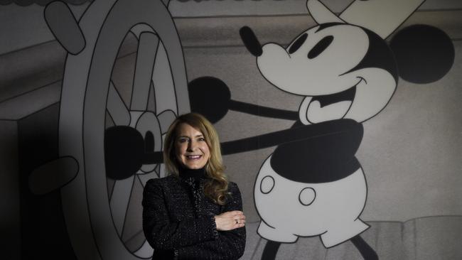 Walt Disney Animation Research conservation manager and exhibition curator, Kristen McCormick with artwork from Mickey Mouse in Steamboat Willie. Picture: Andrew Henshaw