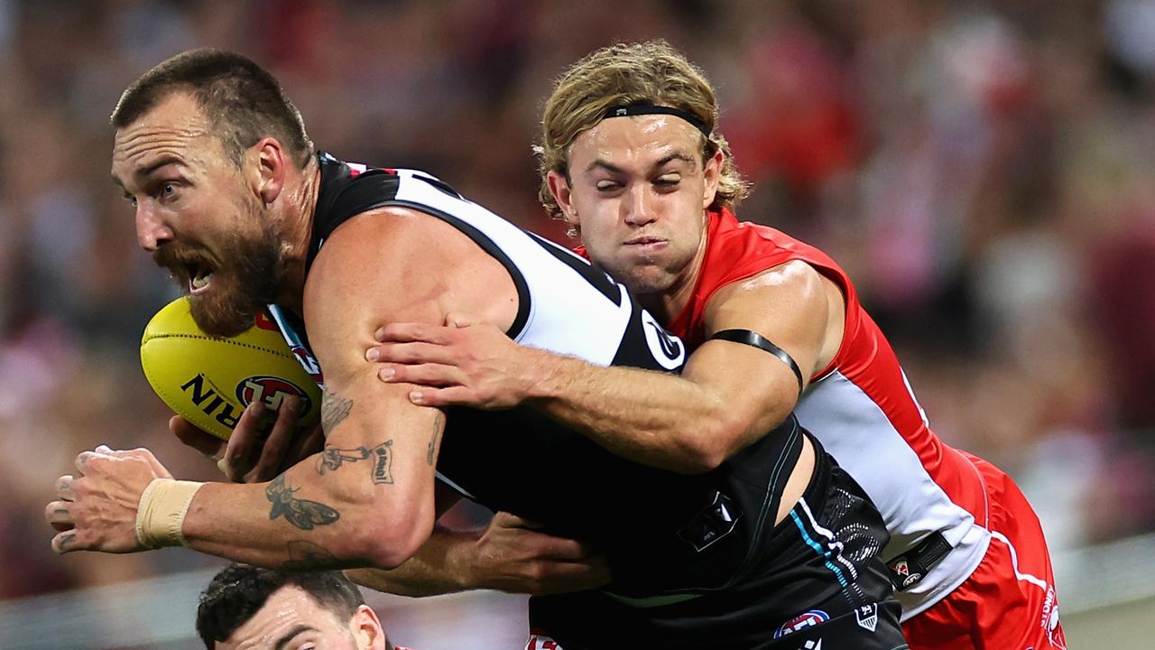 Adelaide, Australia. 03rd June, 2023. Conor Nash of the Hawks is tackled by  Dan Houston and Riley Bonner of the Power during the AFL Round 12 match  between the Port Adelaide Power