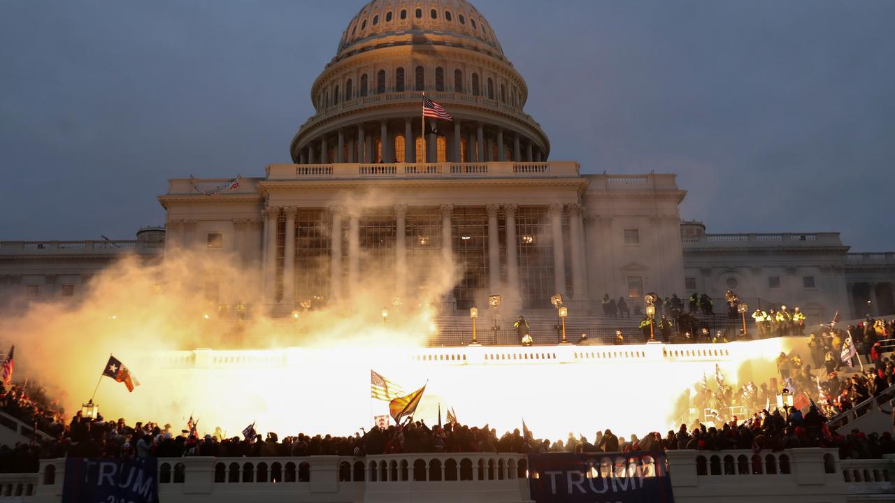 An explosion caused by a police munition is seen while supporters of Donald Trump gather in front of the U.S. Capitol Building. Picture: Reuters/Leah Millis