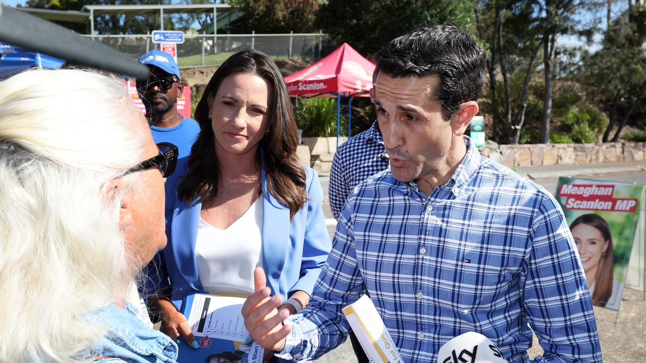 Election day live: Crisafulli confronted by LNP voter