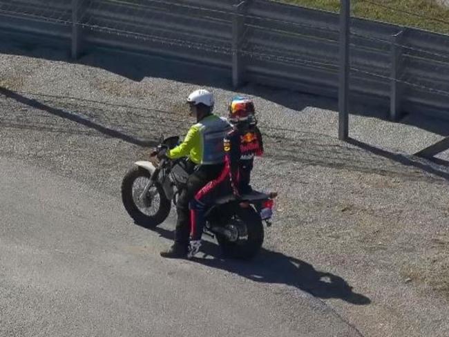 Nothing says F1 heartbreak like a ride on the back of a motorbike.