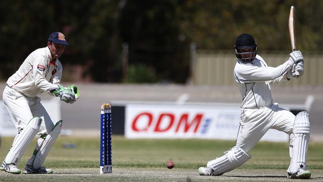 Craigmore’s Dylan McIver cuts away while making a big score for Port Adelaide in grade cricket back in 2016. Picture: Dean Martin