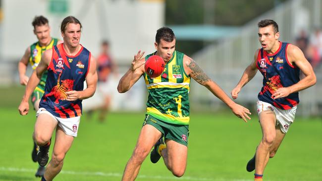 Maroochydore’s Mitchell Scholard evades two Tigers.