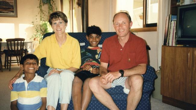 Sue and John Brierley with Saroo and, right, and Mantosh (on floor)