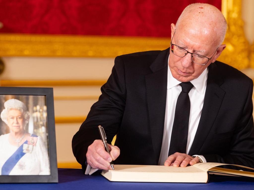 David Hurley as Governor-General of Australia signing a book of condolence following the death of Queen Elizabeth II. Picture: David Parry / Getty