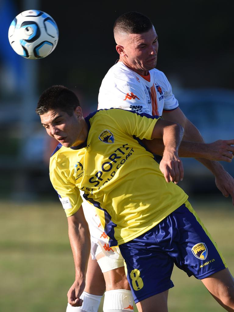 Can Cuba headers the ball for Gold Coast. Picture: Steve Holland