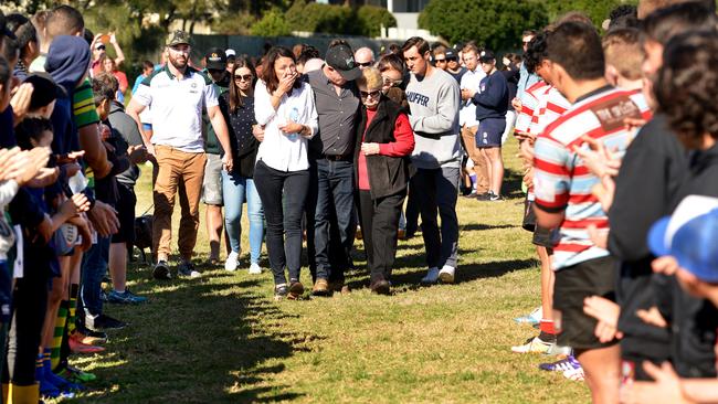 Family members walk through the guard of honour. Picture: Troy Snook