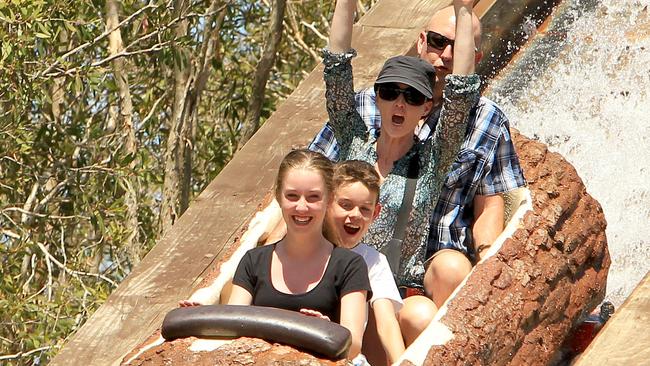 Holiday makers and locals pictured enjoying some of the thrill rides at Dreamworld on the Gold Coast Mr and Mrs Ian and Melissa Kent with their two children Taylor 12 and Kya 9 of  Adelaide on the Rocky Hollow Log Ride . Pic Mike Batterham