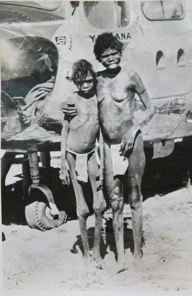 Helicopter Tjungurrayi with his aunty Kupunyina in front of the Bristol Sycamore helicopter that flew them to Balgo Hills Mission. Picture: Jim Ferguson, used with permission of Helicopter Tjungurrayi