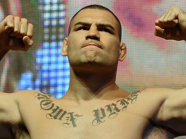 LAS VEGAS, NV - JULY 08: Mixed martial artists Cain Velasquez poses on the scale during his weigh-in for UFC 200 at T-Mobile Arena on July 8, 2016 in Las Vegas, Nevada. Velasquez will meet Travis Browne in a heavyweight bout on July 9 at T-Mobile Arena. (Photo by Ethan Miller/Getty Images)