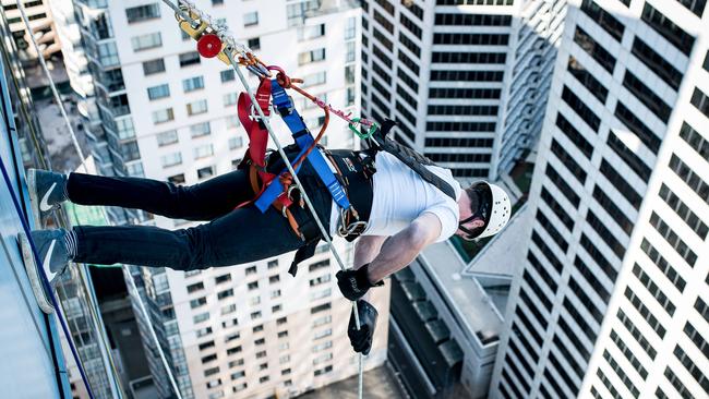 Jude Bolton abseiled face first down the 33-storey building. Picture: Matias Gwyther