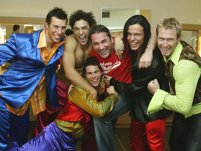 Darren Sutton (bottom) with his fellow Strip Search winners in 2003.