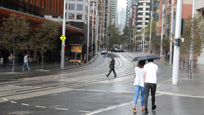 Pedestrians were scarce on George Street, Sydney. Picture: John Feder